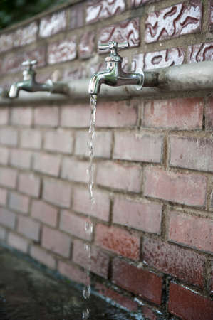 Landscape with clear tap water drippingの写真素材