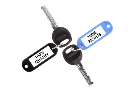 Keys on a white background  Keys with plastic tagの写真素材