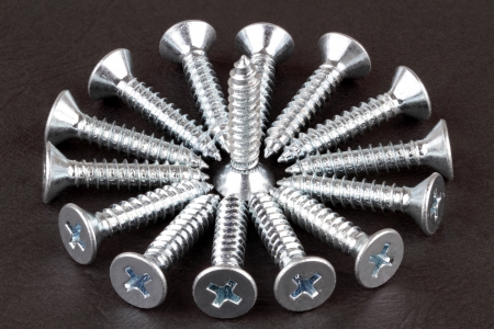 Screws on a dark background の写真素材