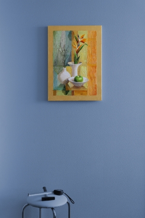 painting on the wall at the blue-gray background in the room;  only picture that hung on the wall and tools on a chair on a gray-blue background; の写真素材