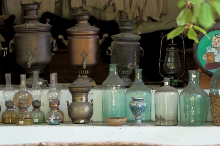 samovars glass bottles petrol lamps clothesの写真素材