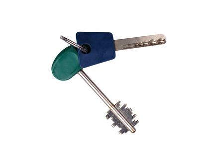 bunch of metal door keys isolated on white background