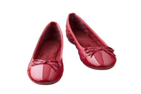 red female shoes closeup view from above on white backgroundの写真素材