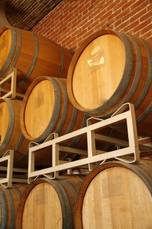 Wooden wine barrels in the wineyard cellar