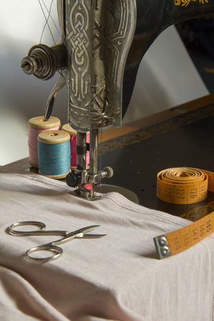 Sewing machine,accessories and item of clothing material