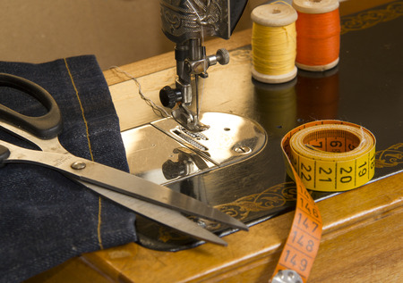Vintage Sewing machine,accessories and item of clothing material