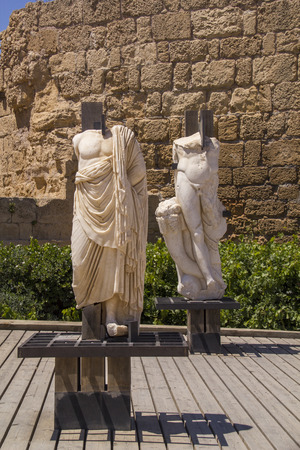 Ancient statues and marine artifacts in harbor of Caesarea National Park.Israel.Caesarea Maritima from 133 AD onwards, was a city and harbor built by Herod the Great about 25-13 BC. Today, its ruins lie on the Mediterranean coast of Israelのeditorial素材