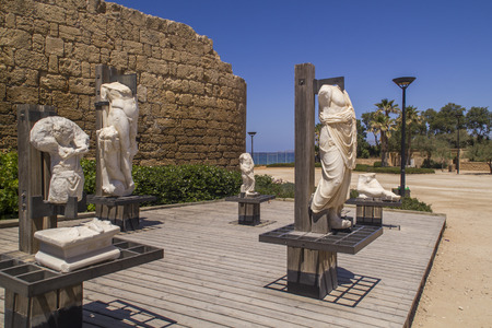 Ancient statues and marine artifacts in harbor of Caesarea National Park.Israel.Caesarea Maritima from 133 AD onwards, was a city and harbor built by Herod the Great about 25-13 BC. Today, its ruins lie on the Mediterranean coast of Israelのeditorial素材