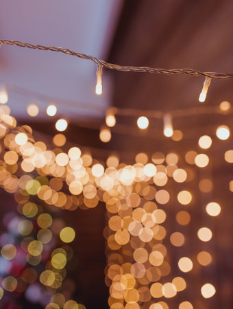 garland yellow cozy lights with bokehの写真素材