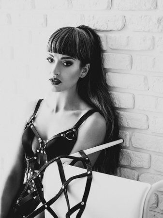 pretty sexy girl or beautiful woman with brunette hair and adorable face has fashionable makeup on...