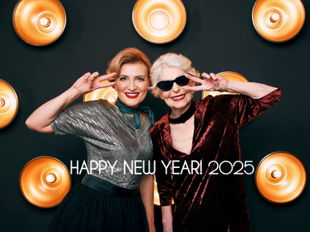 senior stylish elegant woman in sunglasses with friend on lamps dark background. Party, fashion, celebration, anti age conceptの写真素材