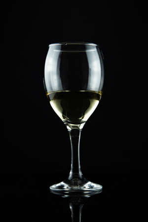 wine bottle and glass, black backgroundの写真素材