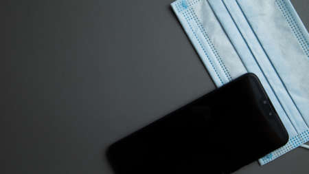 biosafety element white mask accompanied by technological objects on a unicolor backgroundの写真素材