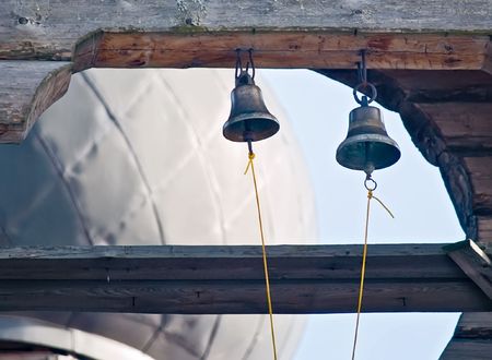 Two small bells on wooden orthodox church. Russiaの写真素材