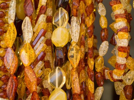 Close-up of different colored bijouterie from amber that can be use as texture or backgroundの写真素材