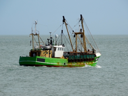 Fishing Trawler heading out to seaの写真素材