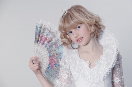 Princess with a crown and with a fanの写真素材
