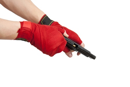 Black gun in a hand isolated on white backgroundの写真素材