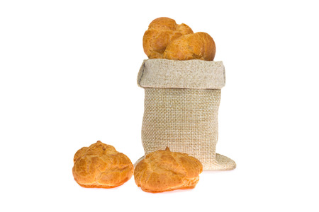 Fragrant rolls in a linen bag isolated on white