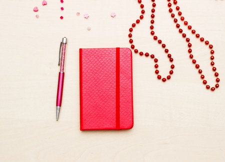 Notebook with  flower on wooden backgroundの写真素材