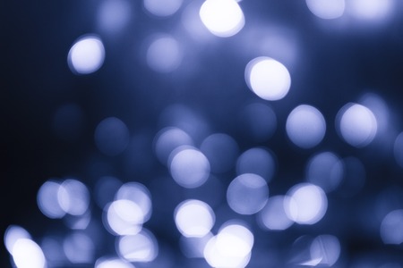 Blue abstract christmas lights as blur backgroundの写真素材