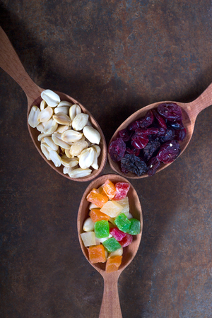 Peanuts, raisins and candied fruits - healthy breakfast.の写真素材
