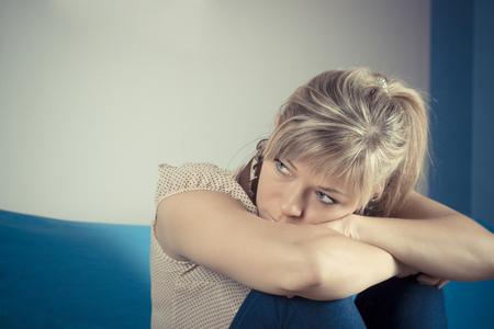 Lonely sad woman deep in the thoughts.の写真素材