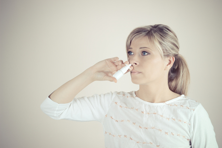 Nasal Spray. Closeup Of Beautiful Young Woman's Face With Nasal Drops. の写真素材