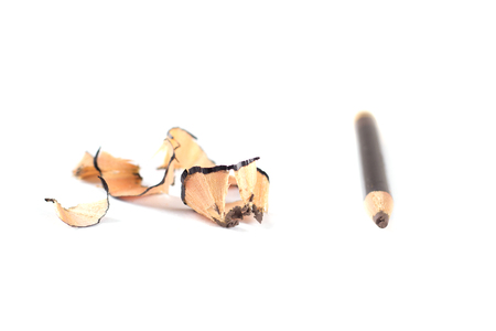 Pencil cosmetic sharpening with husk on white.の写真素材