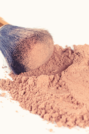 Face powder and brush isolated on white background.の写真素材