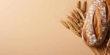 loaf of bread and a spike of wheat on a beige background. ai generativeの素材