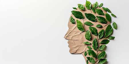 human head with a green leaf, in the style of delicate paper and cardboard cutouts. earth and ecology day conceptの素材