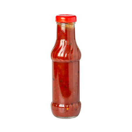tomato hot sauce with paprika in glass bottle with red cap isolated on white backgroundの写真素材
