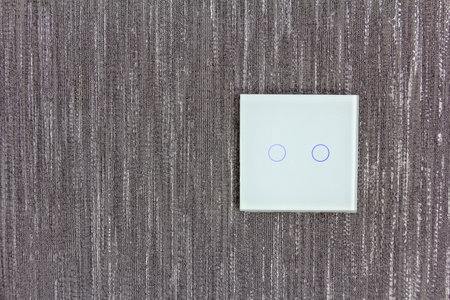 White switch with LED light. Fashionable touch modern white switch. Copy space.