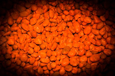Vibrantly colorful pebbles spread is beautiful background.