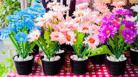 Colorful plastic flowers  in the market.の写真素材