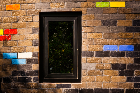 Colorful bricks decorate on the beautiful wall.