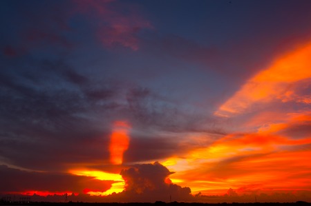 Colorful light Sunset while cloudy at salt field.の写真素材