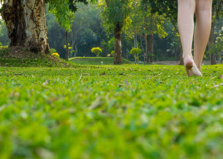 Young woman walking in the field