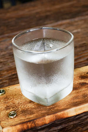 glass of water on a wooden table