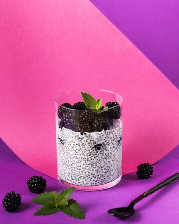 healthy breakfast of chia seeds in coconut milk with berriesの写真素材