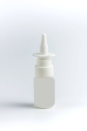 white spray with medicine on white backgroundの写真素材