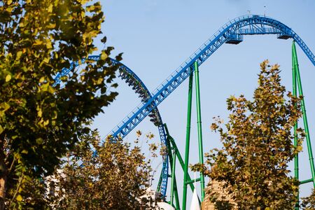 Downhill on a roller coaster. Amusement Park in Turkey Park of Legends. Against the blue sky.の写真素材