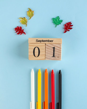 wooden September 1 calendar, colored pens on a blue background. Copy space Art concept of the beginning of the school year.の写真素材