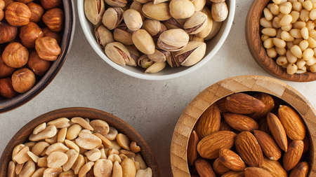 Banner assorted nuts. The dried nuts, hazelnuts, almonds and others. Healthy food, healthy snacks.