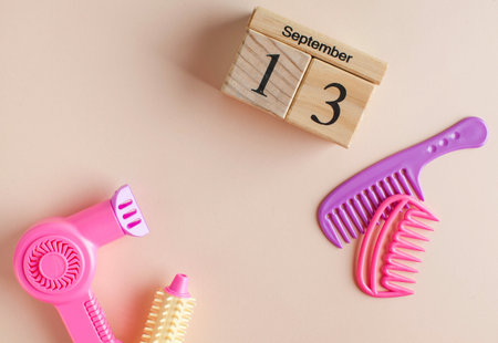 A wooden calendar for September 13 and a toy set for the Barber. The day of the hairdresser. Copy...