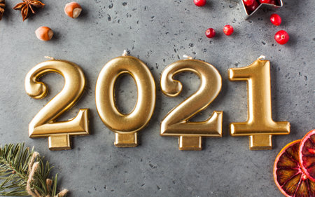 Date 2021 in the form of Golden candles. New year's card, 2021. High quality photoの写真素材