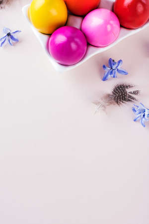 Colorful Easter eggs on a pink background. Bright Easter concept. Copy space.の写真素材