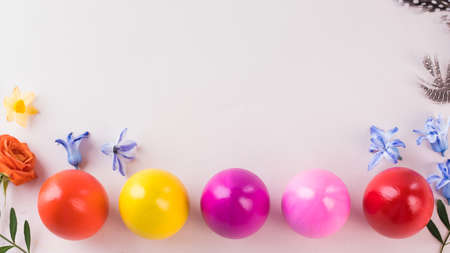 Colorful Easter eggs on a pink background. Bright Easter concept. Copy space.の写真素材