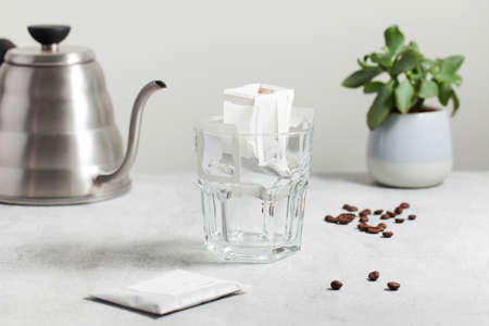 Drip coffee bag in a mug. Trends in brewing coffee at home.の写真素材